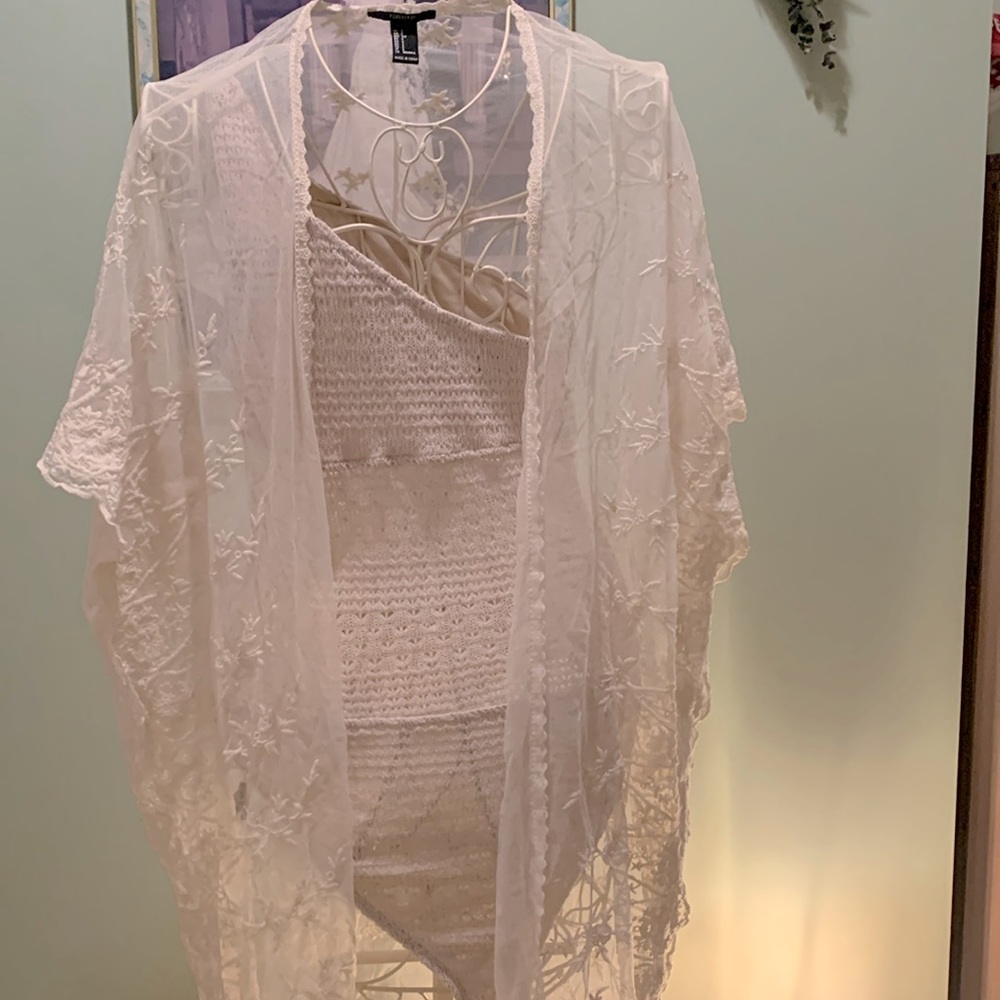 Off white cover up with beige knit material body suit. Smoke & pet free home,